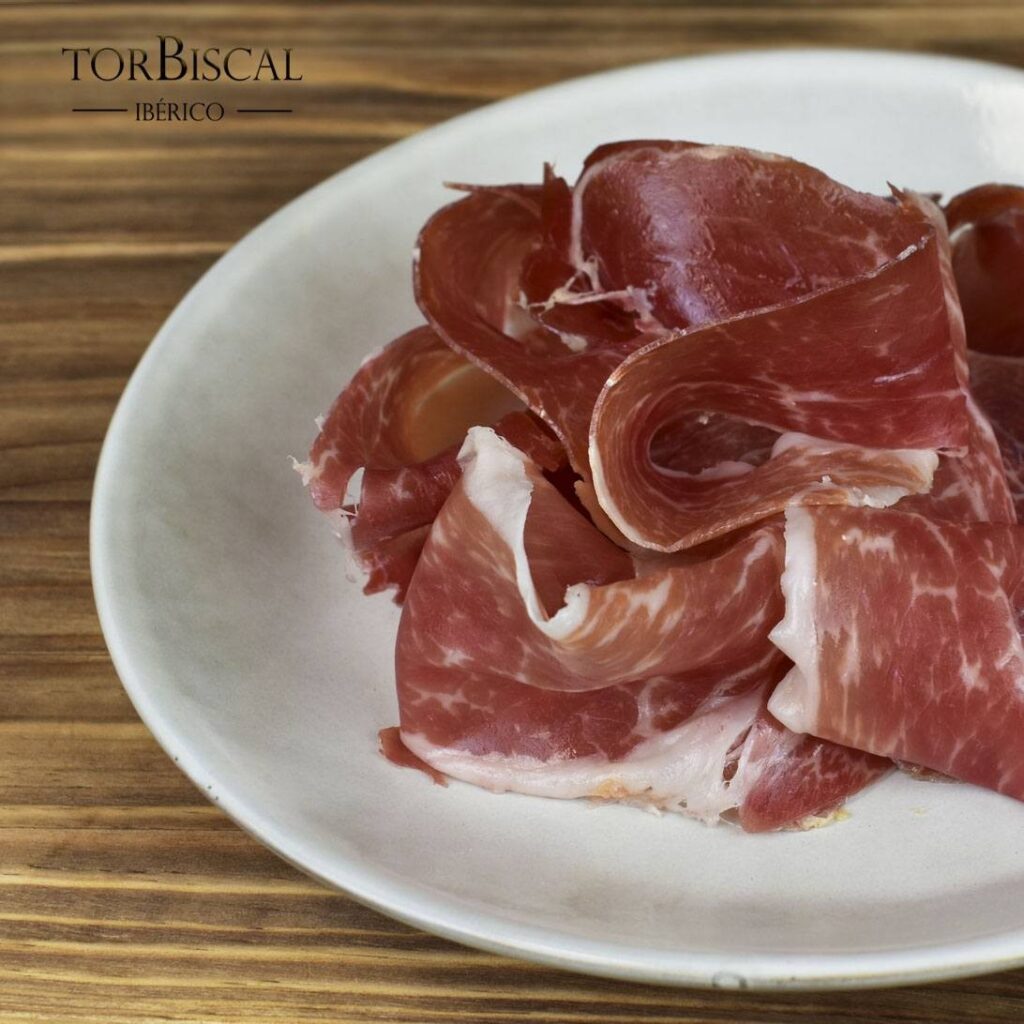 Fotografía artística para jamón ibérico cebo corte máquina